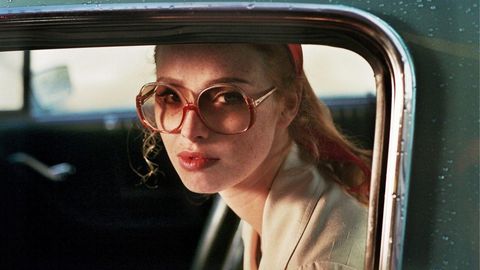 Image of The Lady in the Car with Glasses and a Gun